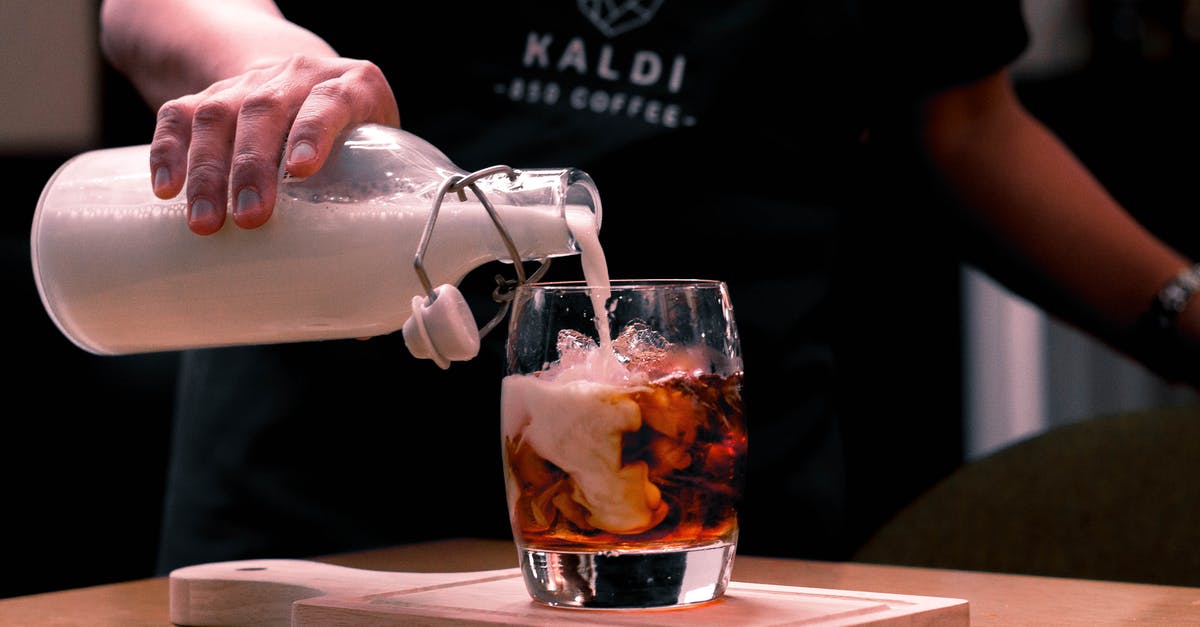 Purpose of condensed milk in mango ice cream? - Photo Of Person Pouring Milk On Glass Purpose of condensed milk in mango ice cream? - Photo Of Person Pouring Milk On Glass