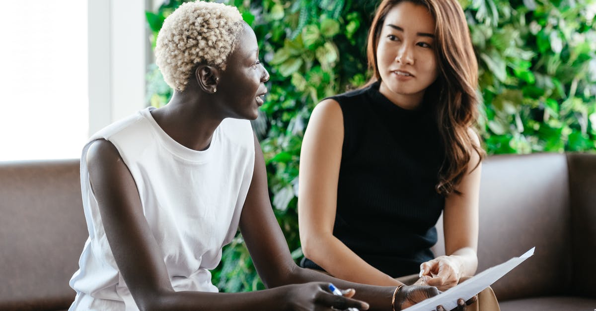 Question on yeast quality? - Diverse women talking about job while discussing contract and looking at each other in conference hall Question on yeast quality? - Diverse women talking about job while discussing contract and looking at each other in conference hall