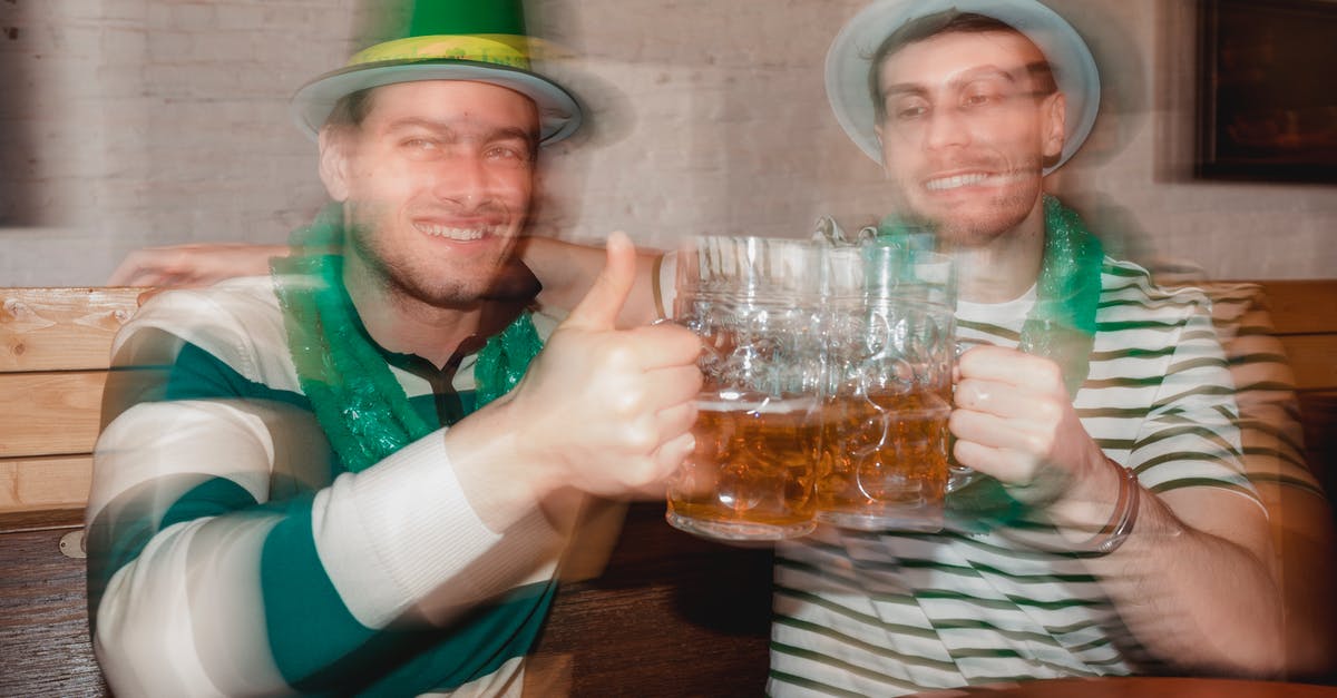 Quiche filling sets like an Aero bar? - Content male partners in shamrock hats with jars of beer celebrating Feast of Saint Patrick at table in pub Quiche filling sets like an Aero bar? - Content male partners in shamrock hats with jars of beer celebrating Feast of Saint Patrick at table in pub