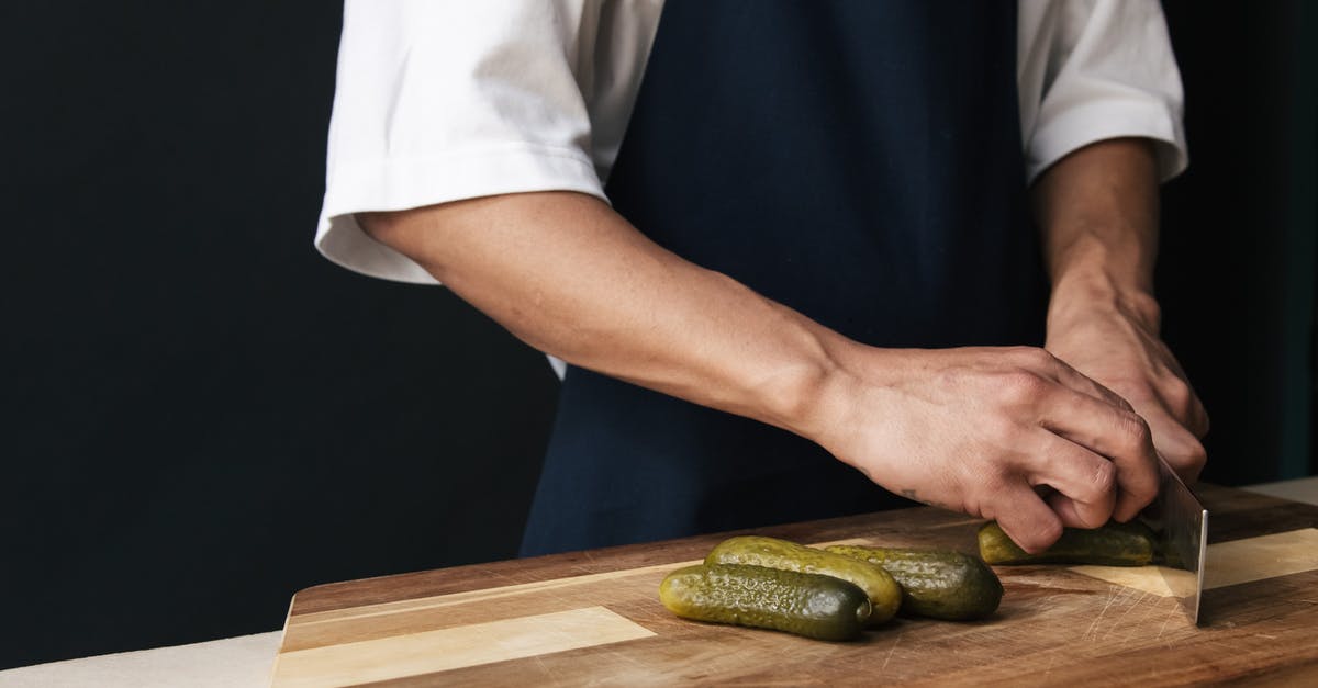 "Post Brine" for Lacto-Fermented Cucumbers (Dill Pickles) - Person Cutting a Cucumber "Post Brine" for Lacto-Fermented Cucumbers (Dill Pickles) - Person Cutting a Cucumber