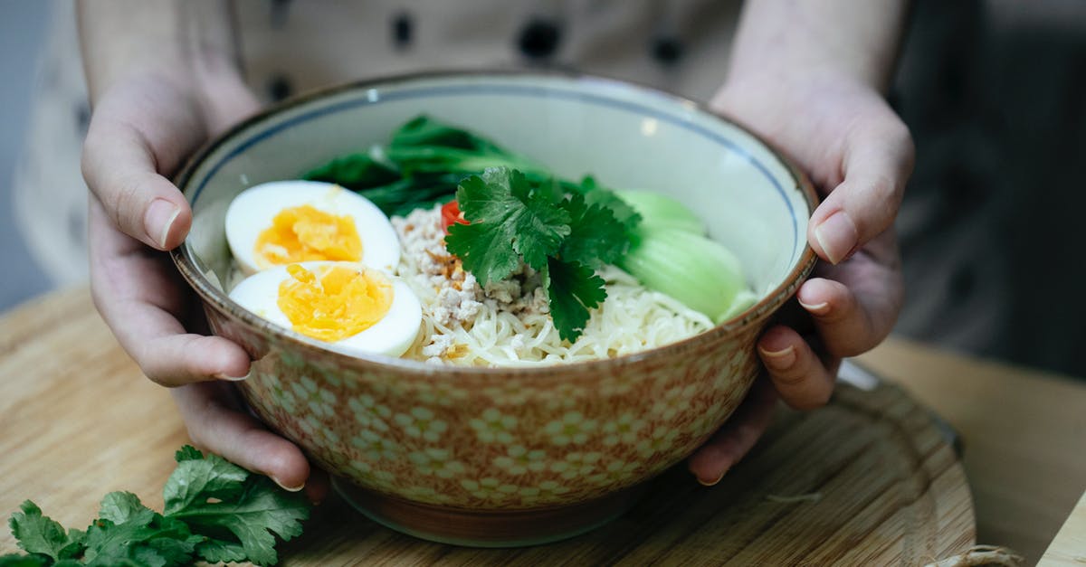 Ramen with Egg :: Screwed Up Something - Crop unrecognizable woman touching bowl with traditional ramen soup Ramen with Egg :: Screwed Up Something - Crop unrecognizable woman touching bowl with traditional ramen soup
