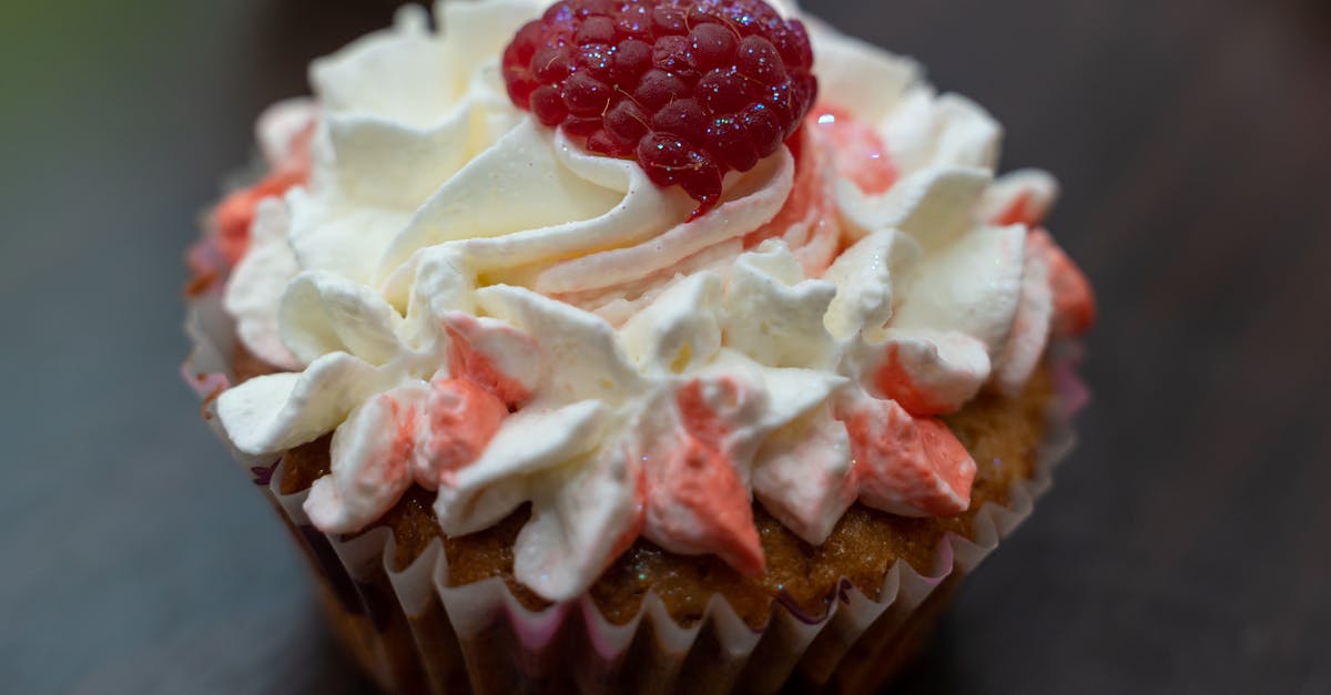 Raspberries too wet in muffin - White and Red Icing Covered Cupcake Raspberries too wet in muffin - White and Red Icing Covered Cupcake