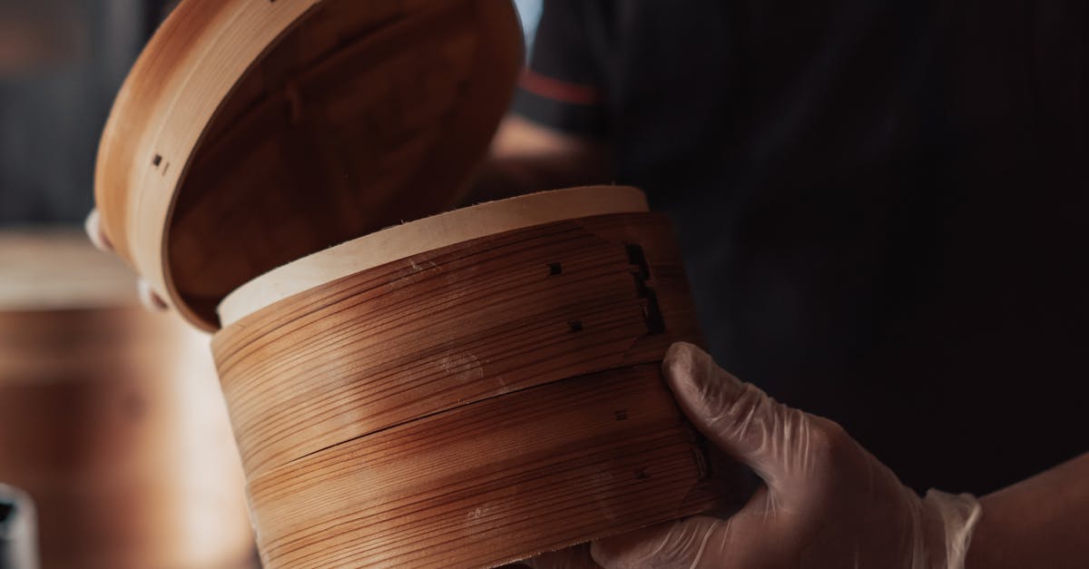 Recommend decent, sturdy steamer basket? - Person Holding Bamboo Round Steamer Basket Recommend decent, sturdy steamer basket? - Person Holding Bamboo Round Steamer Basket
