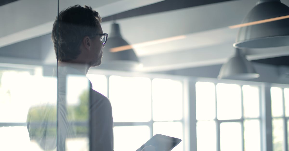 Recommendations for spice organization strategies - Formal man with tablet giving presentation in office Recommendations for spice organization strategies - Formal man with tablet giving presentation in office
