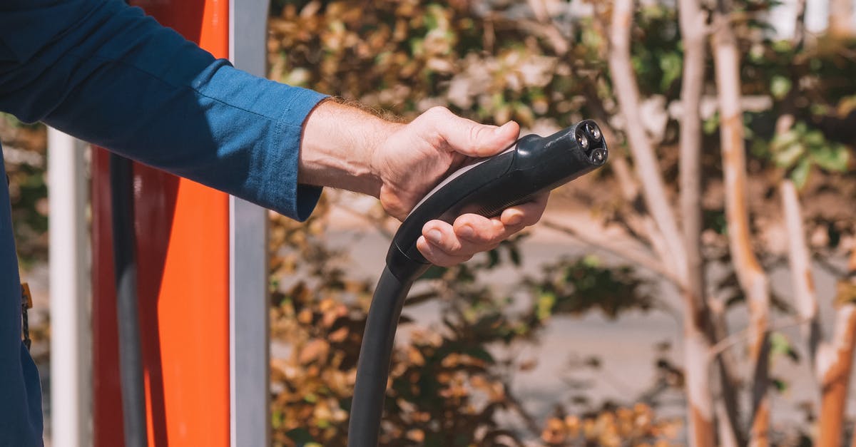 Reconciling Food Safety Tips: Food vs Water - Person Holding Black Car Steering Wheel Reconciling Food Safety Tips: Food vs Water - Person Holding Black Car Steering Wheel