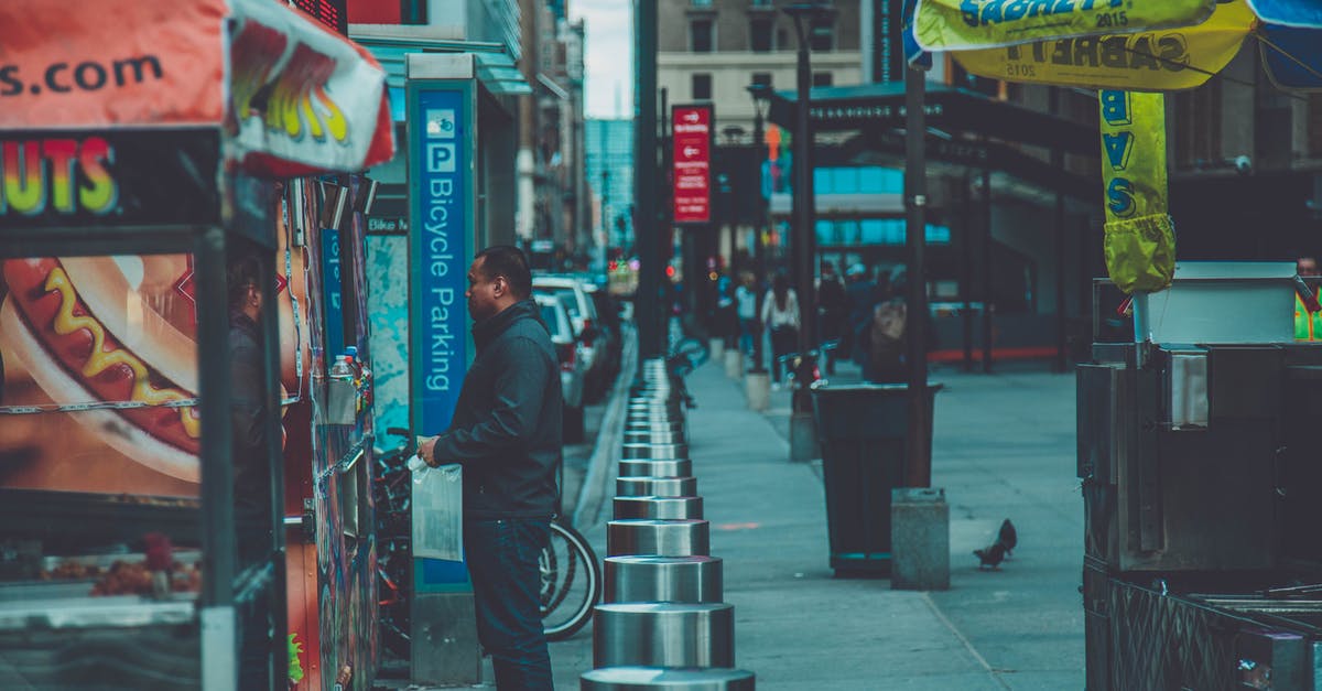 Recreating New York street vendors' "halal chicken over rice" - Man Standing in Front of Food Stall Recreating New York street vendors' "halal chicken over rice" - Man Standing in Front of Food Stall