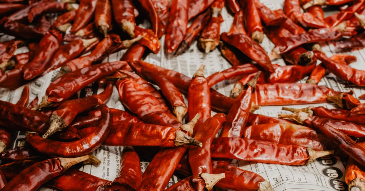 Reduce spiciness of chili [duplicate] - Red and White Plastic Packs