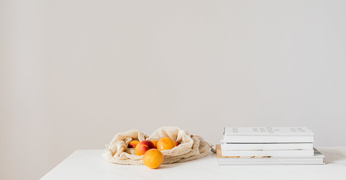 Reduce Sweetness in Fudge - Jute sack with natural ripe apricots on white table composed with stack of various books and magazines Reduce Sweetness in Fudge - Jute sack with natural ripe apricots on white table composed with stack of various books and magazines