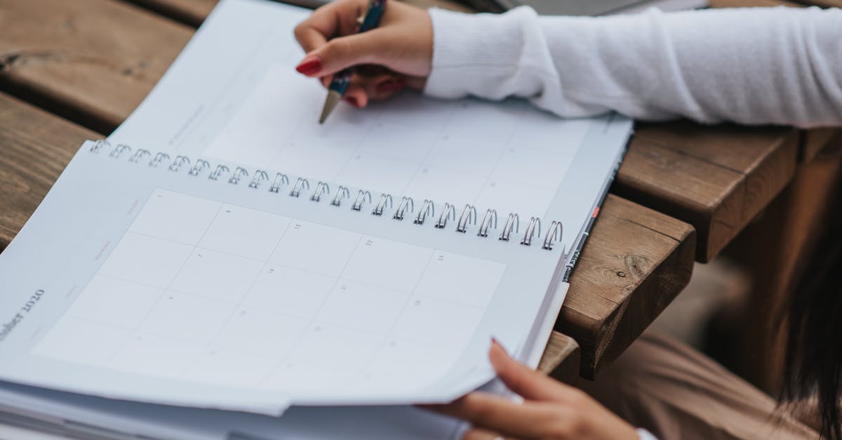 Refrigerated lunchboxes turn soggy - Crop woman making schedule in planner Refrigerated lunchboxes turn soggy - Crop woman making schedule in planner