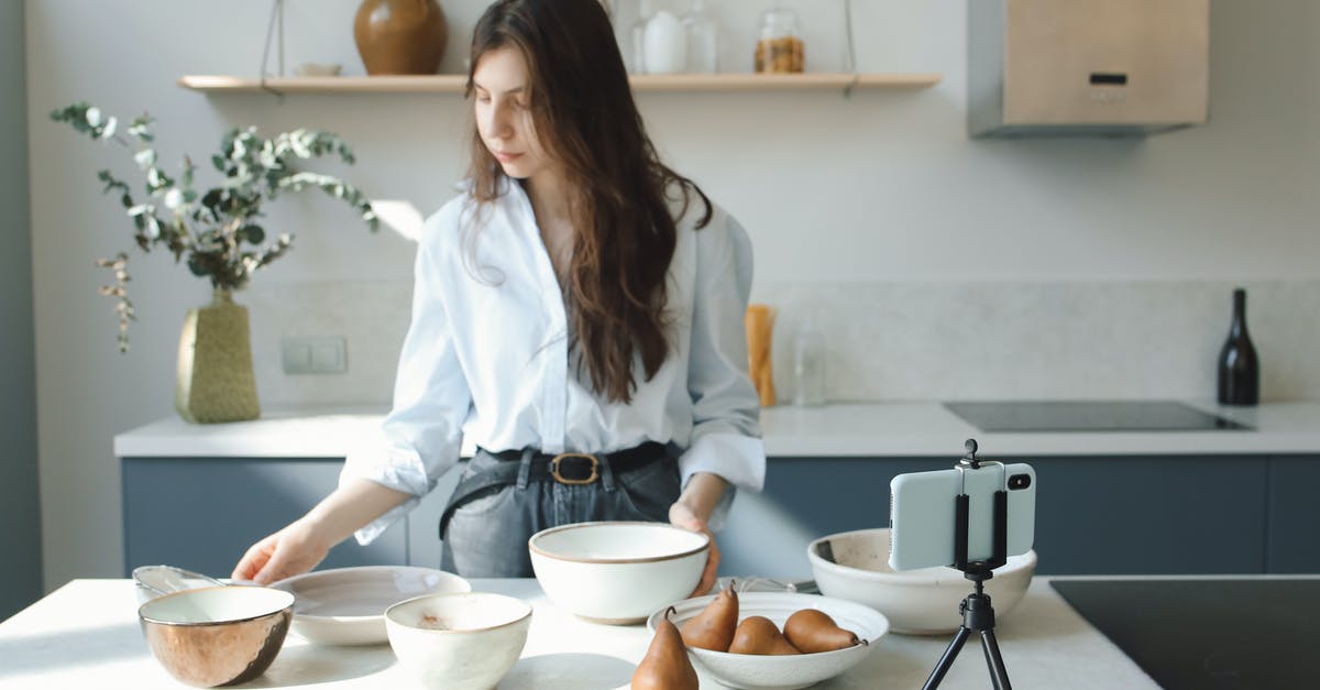 Regarding cutlery and industrial dishwashers - Woman in White Button Up Shirt Holding White Ceramic Bowl