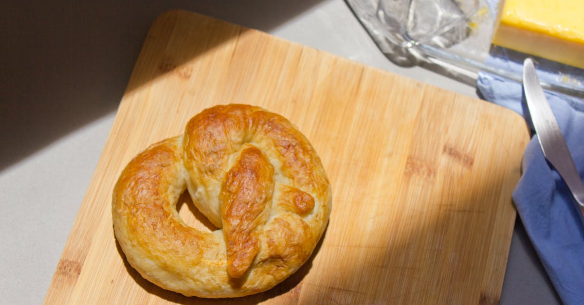 Reheating a Pretzel - Overhead Shot of a Soft Pretzel on a Wooden Chopping Board