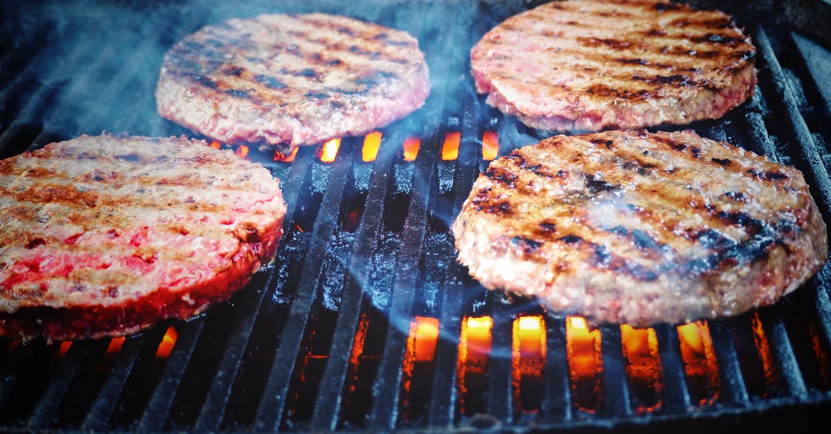Reheating grilled hamburger patties - Shallow Focus Photo of Patties on Grill Reheating grilled hamburger patties - Shallow Focus Photo of Patties on Grill