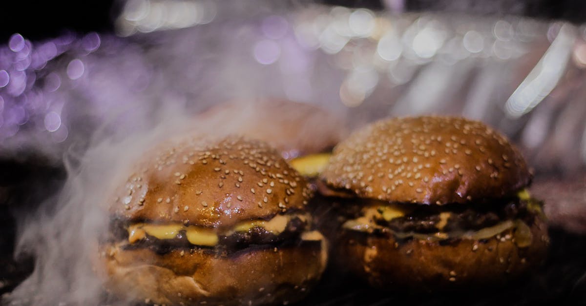 Reheating grilled hamburger patties - Burger on Black Metal Grill Reheating grilled hamburger patties - Burger on Black Metal Grill