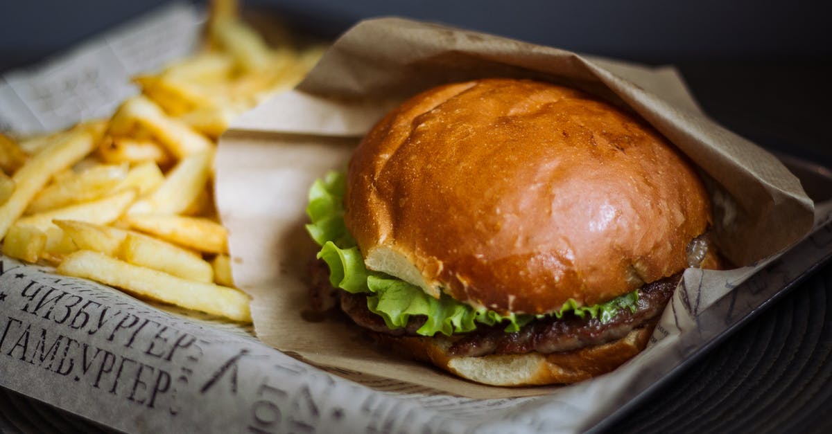 Reheating Hamburger Helper - Burger With Lettuce and Fries on Brown Wooden Chopping Board Reheating Hamburger Helper - Burger With Lettuce and Fries on Brown Wooden Chopping Board