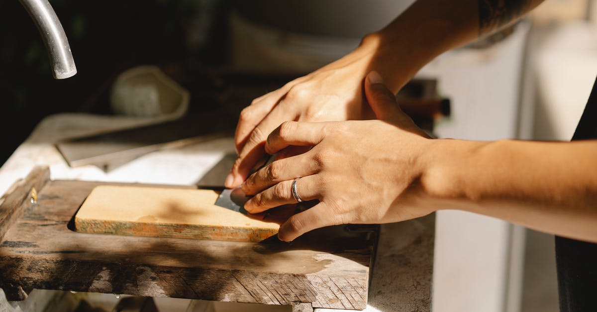 Removing metal disc ring from chocolate mousse: which method should I use? - Crop joiner working with wooden block using sharp tool Removing metal disc ring from chocolate mousse: which method should I use? - Crop joiner working with wooden block using sharp tool