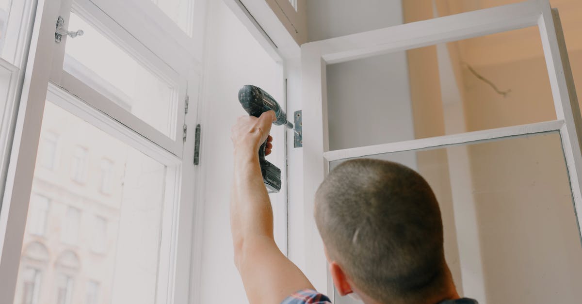Replacement for alliums? - Anonymous man installing window in room Replacement for alliums? - Anonymous man installing window in room
