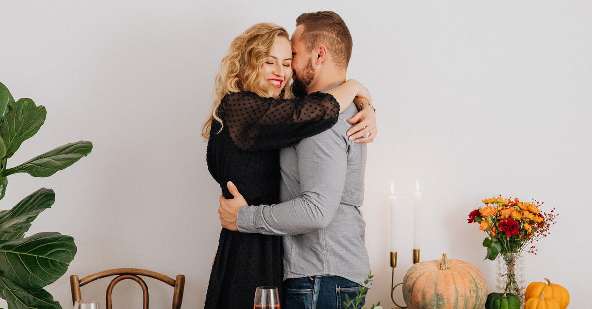 Replacement for pumpkin - Man in Gray Sweater Hugging Woman in Black Sweater