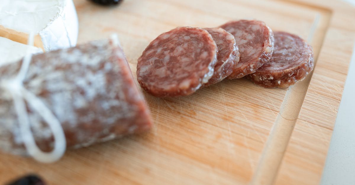 Replacing red wine by vinegar to do a beef salami - 2 Brown Stones on Brown Wooden Table Replacing red wine by vinegar to do a beef salami - 2 Brown Stones on Brown Wooden Table