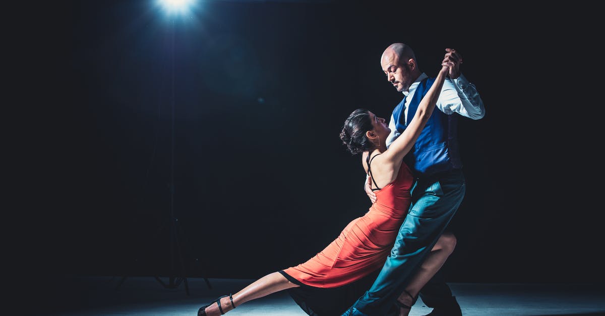 Reprocessing Salsa - Woman And Man Dancing Under Light Reprocessing Salsa - Woman And Man Dancing Under Light