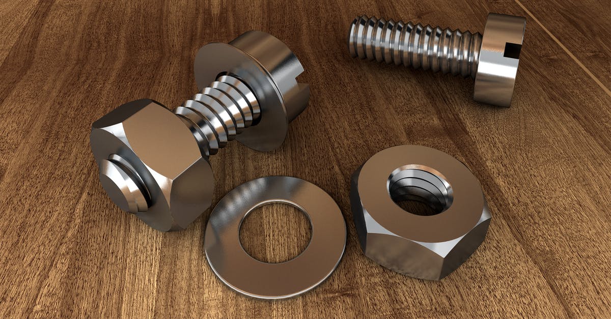 Residue on a new hard-nitriding cast iron skillet - Two Gray Bolts and Nuts on Wooden Surface Residue on a new hard-nitriding cast iron skillet - Two Gray Bolts and Nuts on Wooden Surface