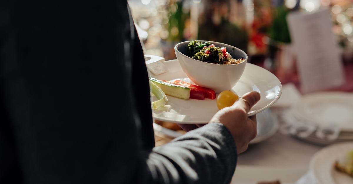 Restaurant: How long can prepped food (cut vegetables, garnishes, etc) be stored before it has to be thrown out? - Crop faceless male with bowl of bulgur with spinach and pomegranate seeds on white plate with cut vegetables standing neat table on blurred background Restaurant: How long can prepped food (cut vegetables, garnishes, etc) be stored before it has to be thrown out? - Crop faceless male with bowl of bulgur with spinach and pomegranate seeds on white plate with cut vegetables standing neat table on blurred background