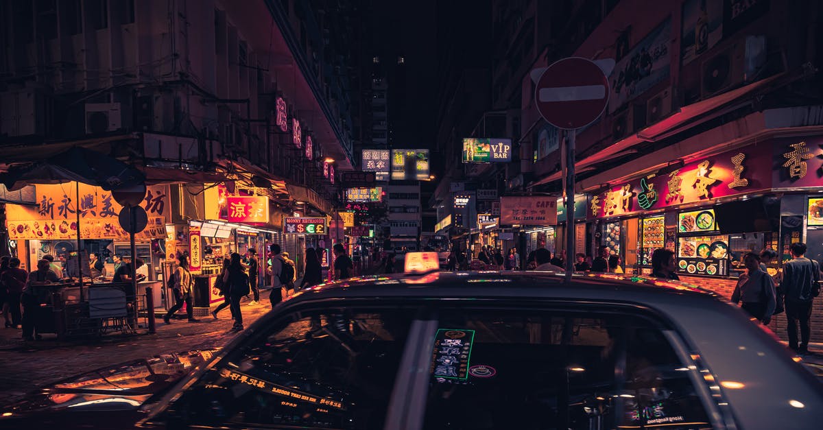 restaurants terms - Photo of Taxi Near Buildings During Nighttime restaurants terms - Photo of Taxi Near Buildings During Nighttime