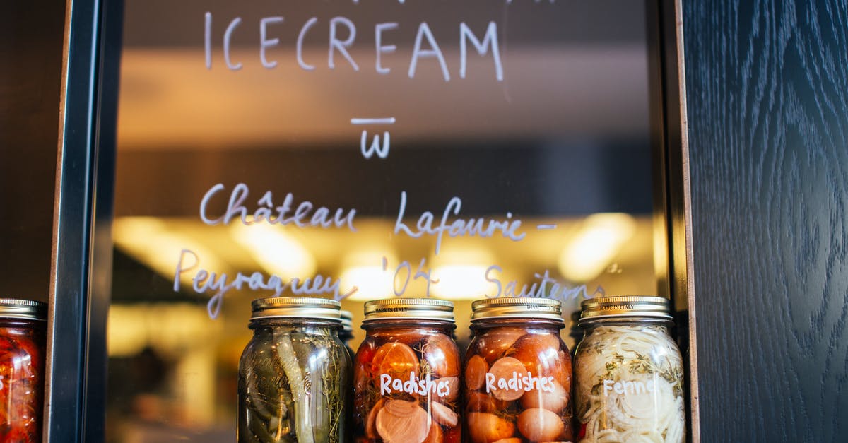 Reusing pickle brine - Jars with various pickled vegetables on shelf in cafe Reusing pickle brine - Jars with various pickled vegetables on shelf in cafe