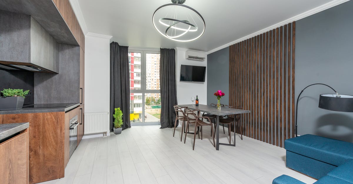 Ribs in oven - foil method - Modern kitchen and dining room interior with furniture in apartment Ribs in oven - foil method - Modern kitchen and dining room interior with furniture in apartment