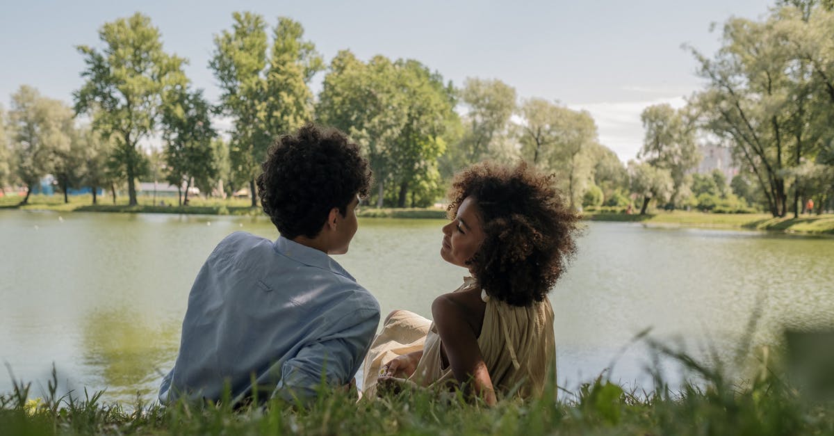Rice - Expiration Date - Couple Sitting on Grass Field Near Body of Water Rice - Expiration Date - Couple Sitting on Grass Field Near Body of Water