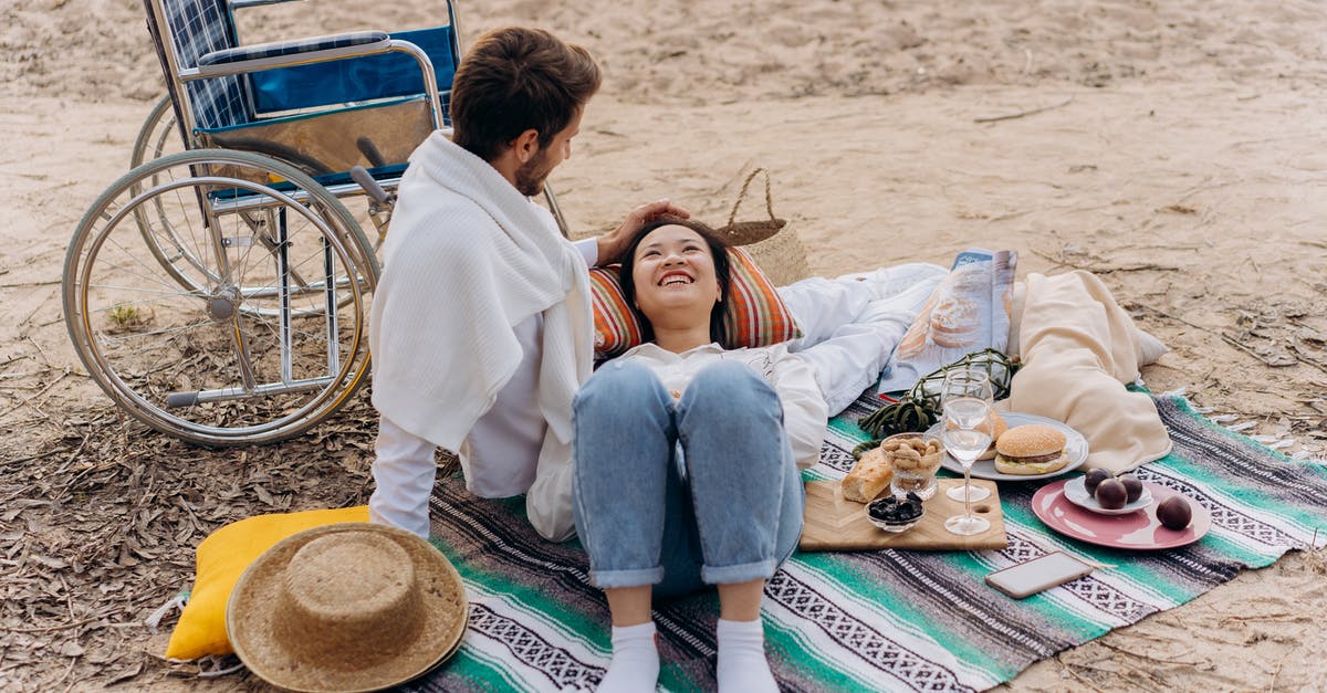 Rice - Expiration Date - Couple Sitting on Green and Blue Mat on Beach Rice - Expiration Date - Couple Sitting on Green and Blue Mat on Beach