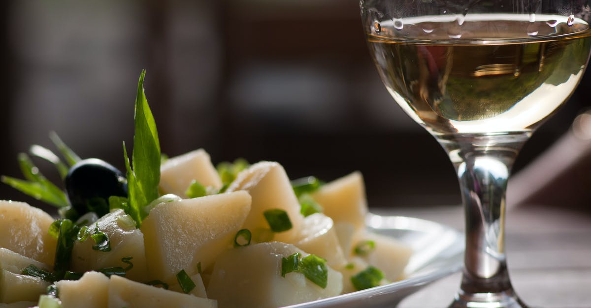 Rice vs pasta and potatoes - Glass of Wine Near Steamed Sliced Potato Dish Rice vs pasta and potatoes - Glass of Wine Near Steamed Sliced Potato Dish