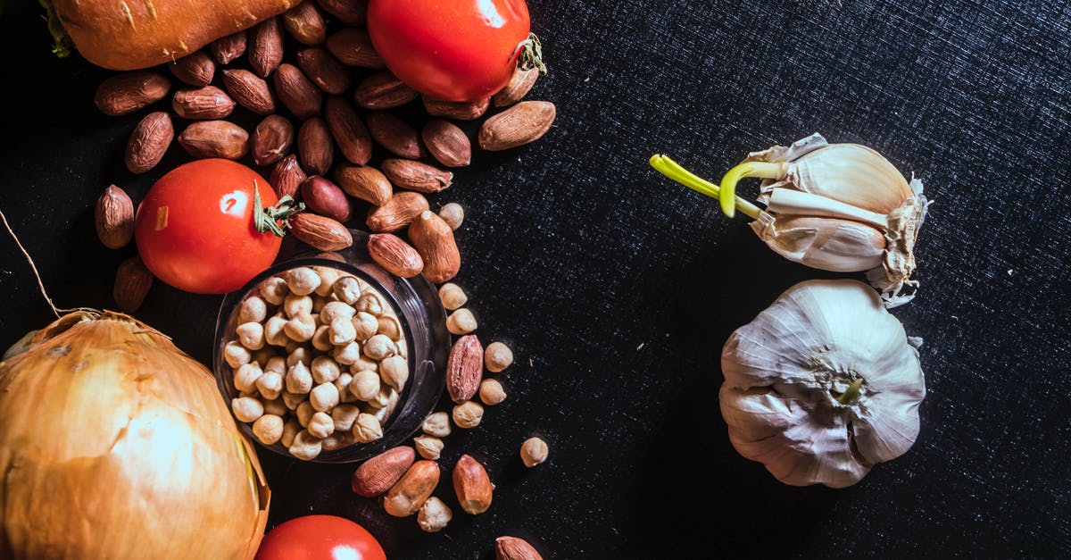 roasted garlic vs. raw - Variety of Spices and Vegetables on Black Surface