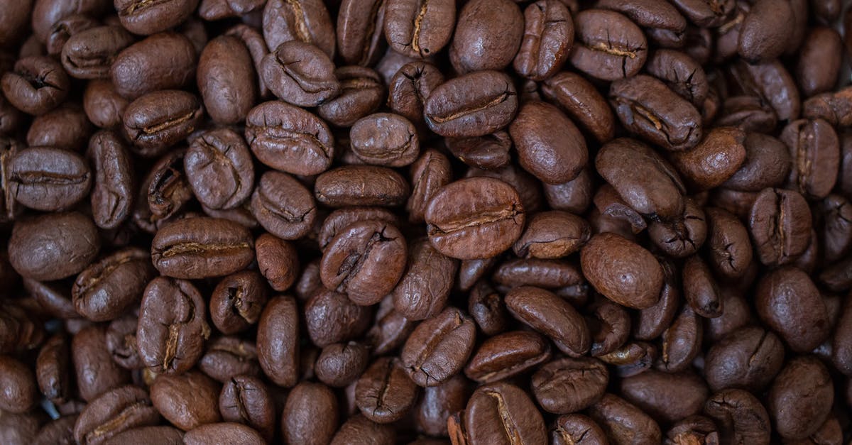Roasted Peanuts - Coffee Beans on Brown Wooden Table