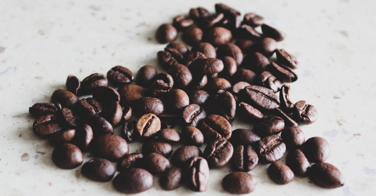 Roasted potatoes: should they be dry? - Coffee Beans on White Surface Roasted potatoes: should they be dry? - Coffee Beans on White Surface