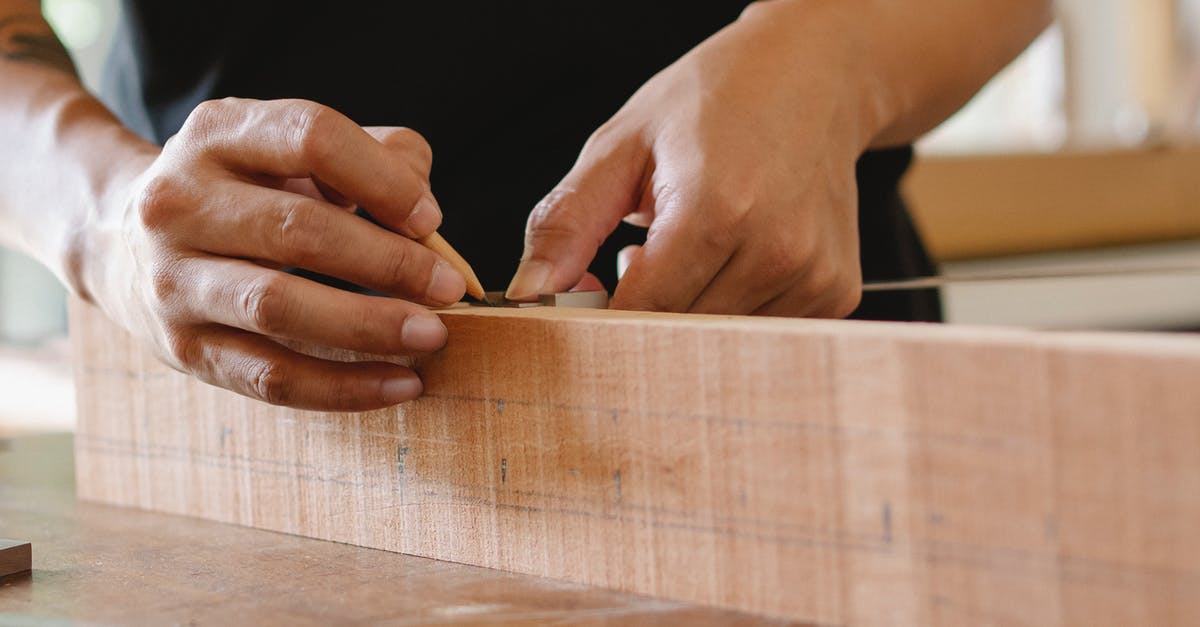 Royal icing - how important is accurate measuring? - Unrecognizable male master using pencil and ruler to measure width of wooden detail while working in professional workshop on blurred background Royal icing - how important is accurate measuring? - Unrecognizable male master using pencil and ruler to measure width of wooden detail while working in professional workshop on blurred background