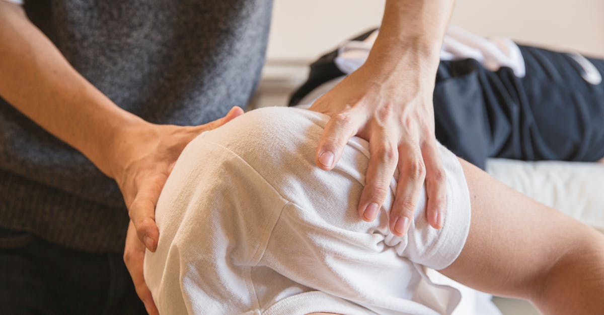 Rub Roast Before or After Searing? - Crop anonymous medical specialist rubbing shoulders of male client lying on couch in medical salon Rub Roast Before or After Searing? - Crop anonymous medical specialist rubbing shoulders of male client lying on couch in medical salon