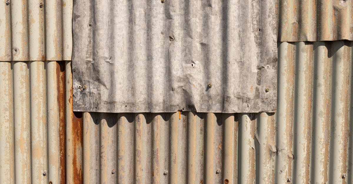 Rust on unknown metal cooking mold - White and Brown Wooden Wall Rust on unknown metal cooking mold - White and Brown Wooden Wall