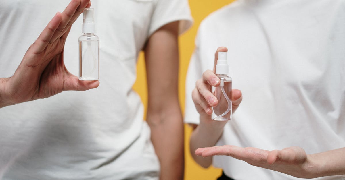 Safe to cook with alcohol - People in White Crew Neck T-shirt Holding Clear Spray Bottles Safe to cook with alcohol - People in White Crew Neck T-shirt Holding Clear Spray Bottles