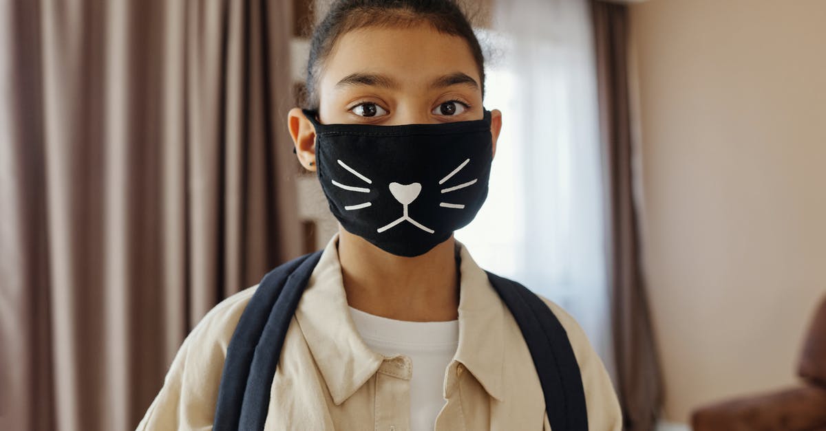 Safety of candies with cat in house? - Little Girl Wearing a Face Mask With a Design Safety of candies with cat in house? - Little Girl Wearing a Face Mask With a Design
