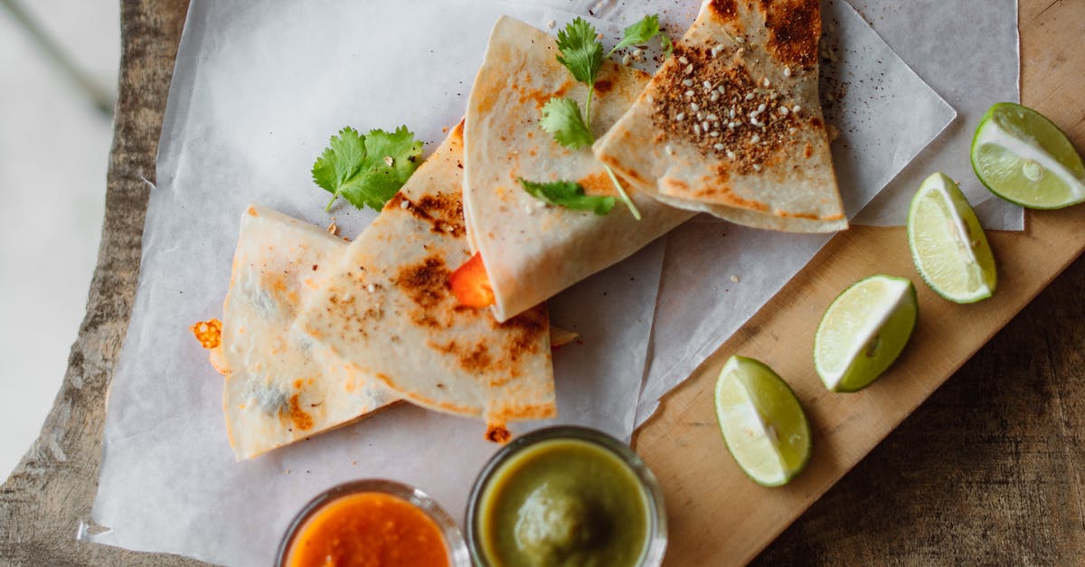Sauce with Jalapeno, garlic, cumin and lime? - Grilled Quesadilla on the Wooden Board Sauce with Jalapeno, garlic, cumin and lime? - Grilled Quesadilla on the Wooden Board