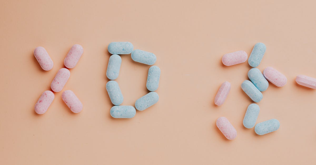 Savory Cotton Candy? - Top view composition of yummy pink and blue candy dots placed on pink background Savory Cotton Candy? - Top view composition of yummy pink and blue candy dots placed on pink background