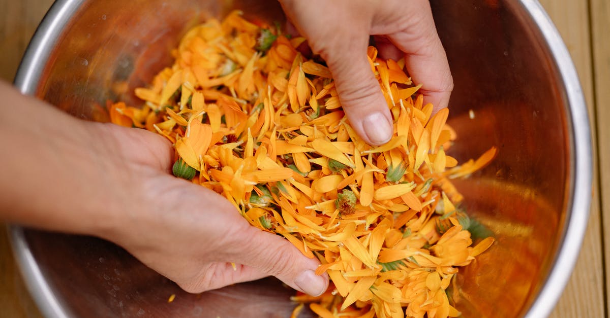 Scaling up a risotto recipe x4. Things to consider? - Person Holding Brown and Yellow Food Scaling up a risotto recipe x4. Things to consider? - Person Holding Brown and Yellow Food