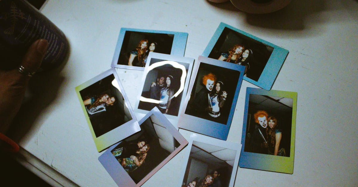 Scary moments - what temperature for broiling? - From above of assorted colorful photos of friends celebrating Halloween near modern photo camera on desk Scary moments - what temperature for broiling? - From above of assorted colorful photos of friends celebrating Halloween near modern photo camera on desk