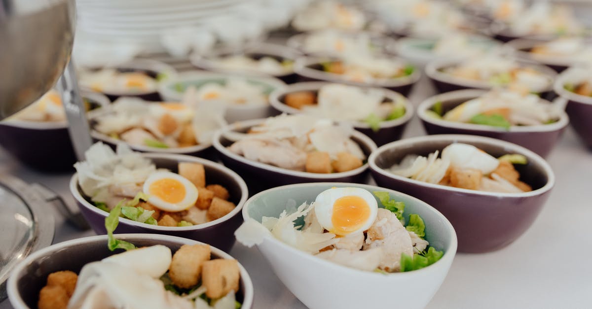 Scrambled eggs for a buffet - Bowls with salad on buffet table
