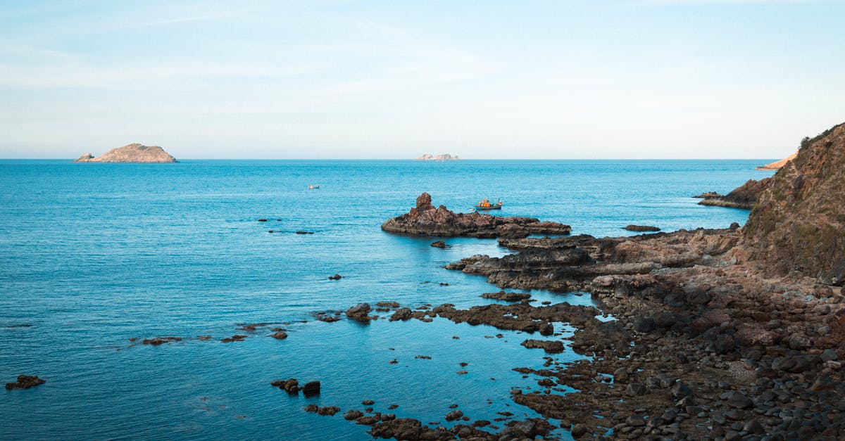 Searing boeuf bourguignon - Brown Rocks on Blue Sea Under Blue Sky Searing boeuf bourguignon - Brown Rocks on Blue Sea Under Blue Sky