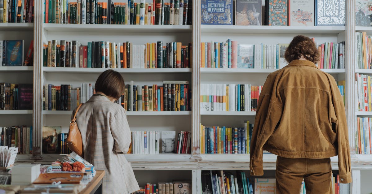 Selecting [corn] for Pozole? - Woman in Brown Coat Standing in Front of Books