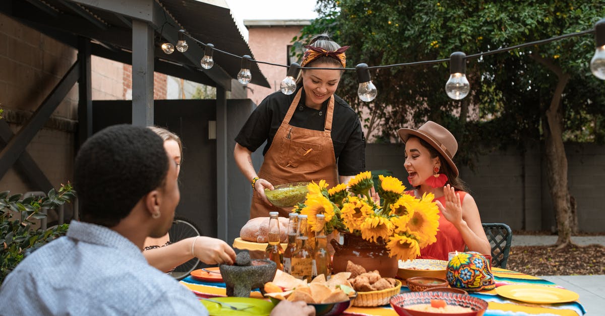 Serving Creme Brulee to a large group of people - Group of Friends Eating Mexican Food Serving Creme Brulee to a large group of people - Group of Friends Eating Mexican Food