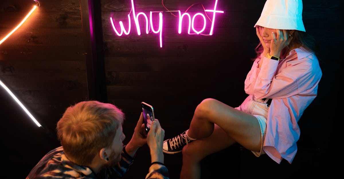 Shaken, not stirred...but why? - Woman in Pink Button Up Shirt Holding Smartphone