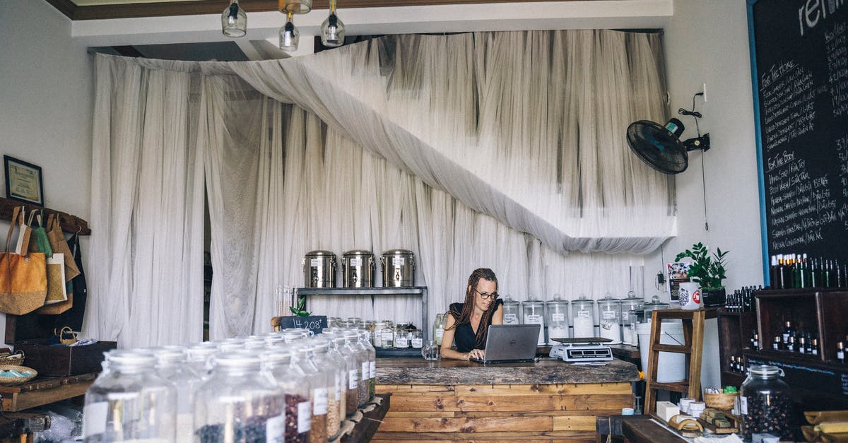 Shelf life of items stored in vacuum containers vs airtight non-vacuum ones? - A Woman using a Laptop at the Counter Shelf life of items stored in vacuum containers vs airtight non-vacuum ones? - A Woman using a Laptop at the Counter