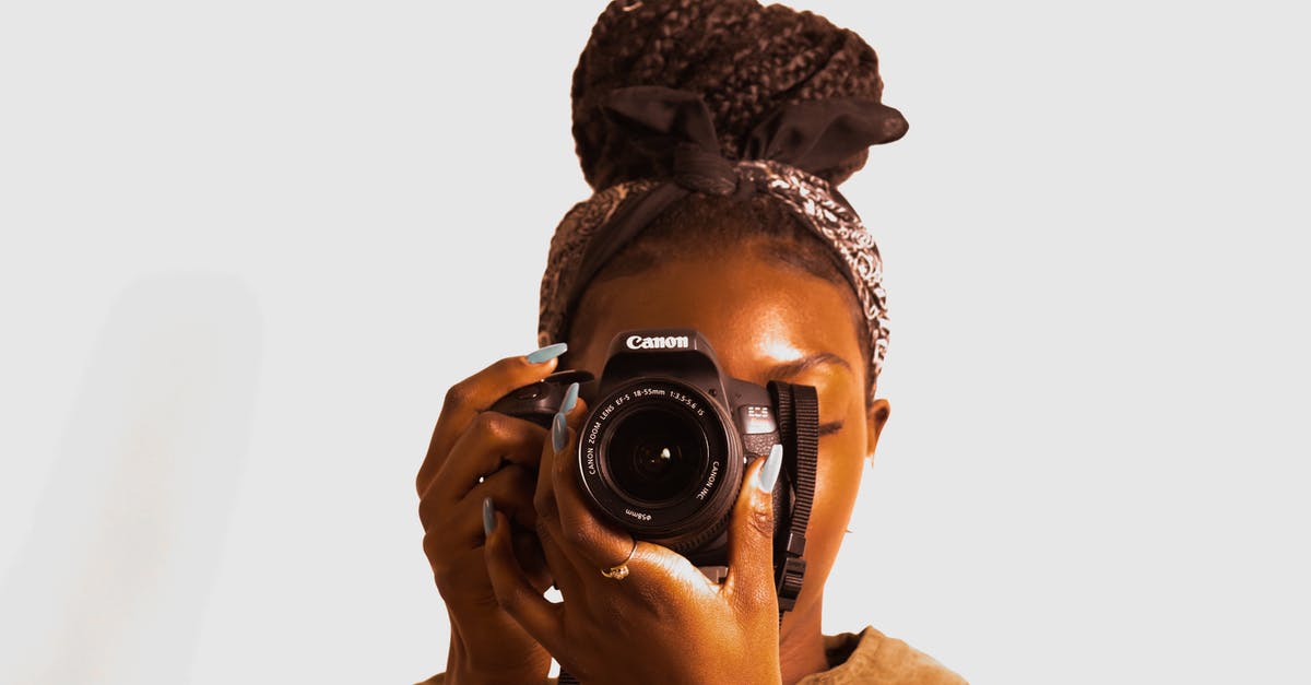 Shortbread with a snap - Woman Using Canon Dslr Camera Shortbread with a snap - Woman Using Canon Dslr Camera